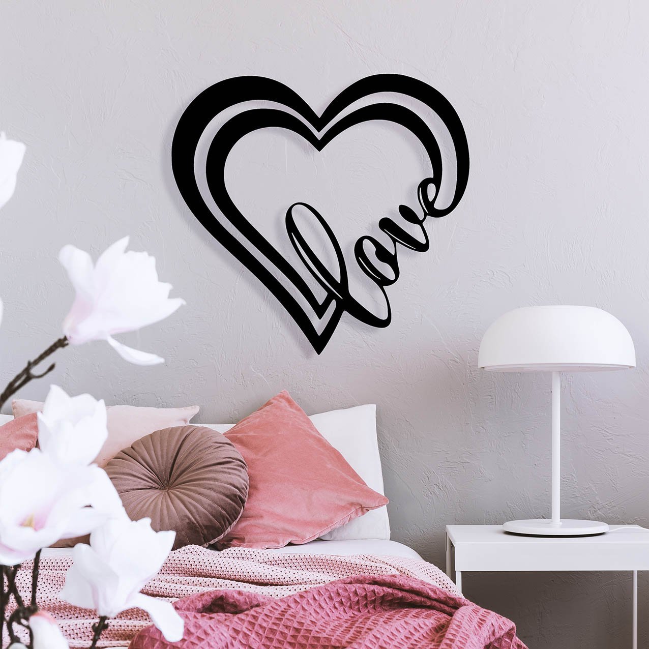 White industrial lamp on simple nightstand table next to cozy be