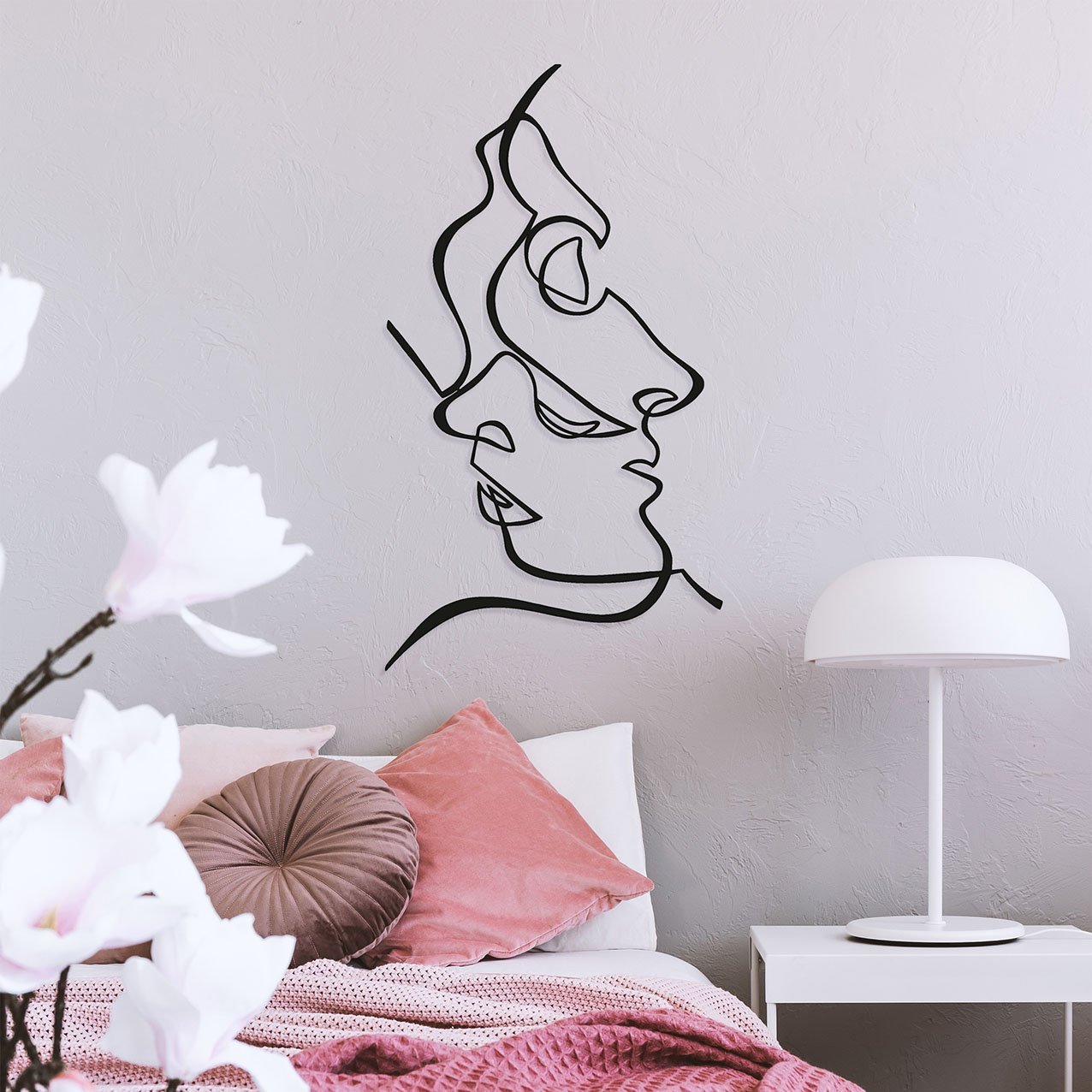 White industrial lamp on simple nightstand table next to cozy be